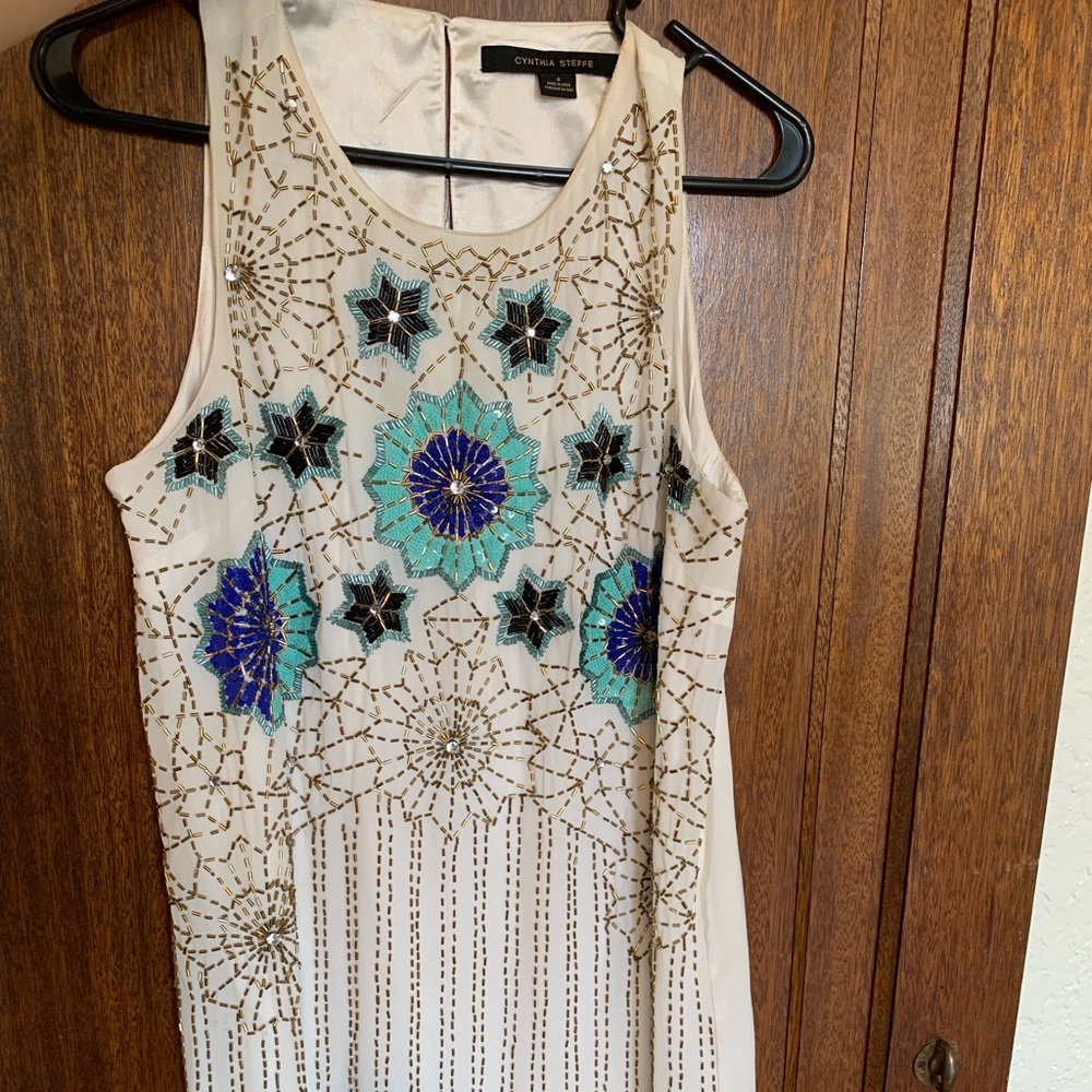 Knee length white full front beaded dress